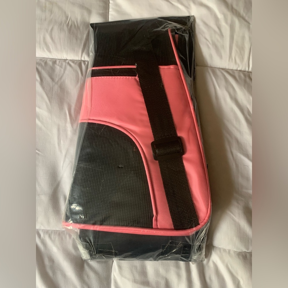 Pink and black small pet carrier